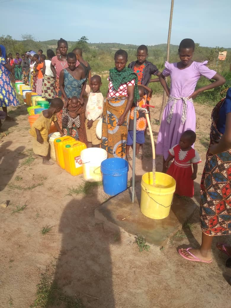 Photo of families fetching water