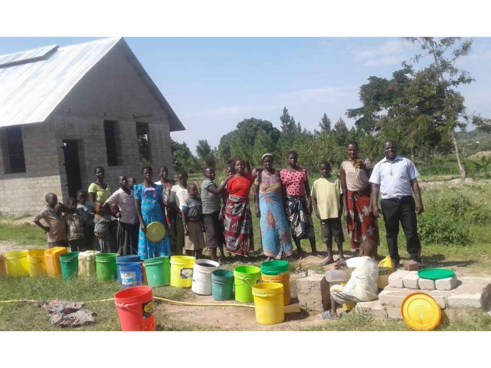 Brother Eli with the families at the water point